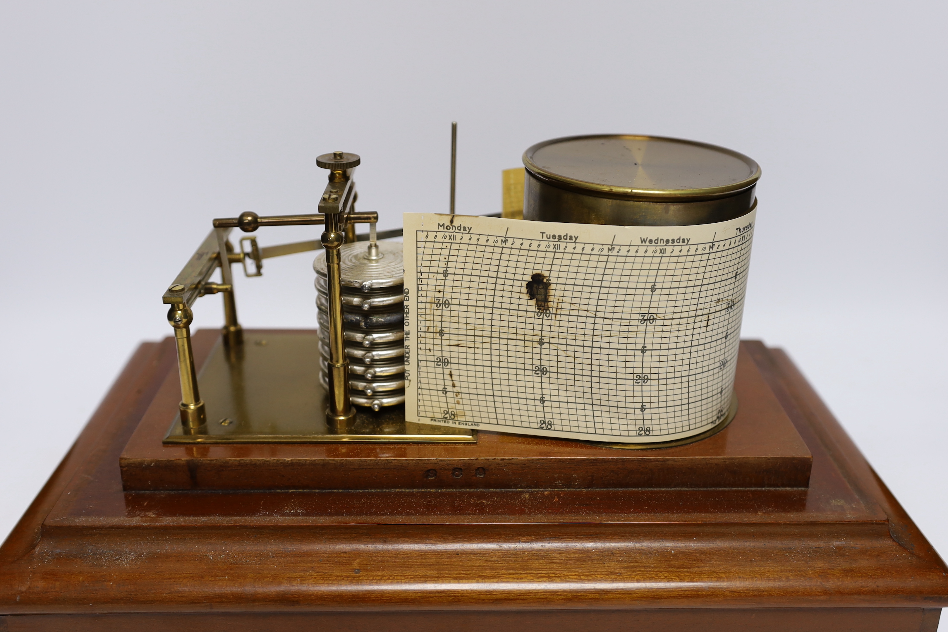 A 20th century barograph by Tycos, in a mahogany case with bevelled glass panels and incorporating an ink bottle and a drawer with spare graph papers, 36.5cm x 21.5cm
